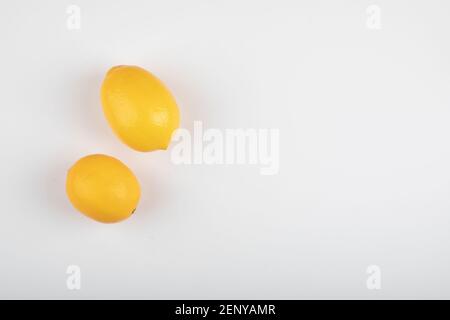 Two yellow lemons isolated on white background Stock Photo