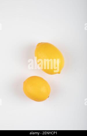 Two yellow lemons isolated on white background Stock Photo