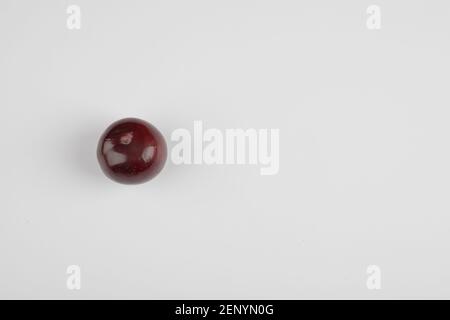 Single cherry plum isolated on white background Stock Photo