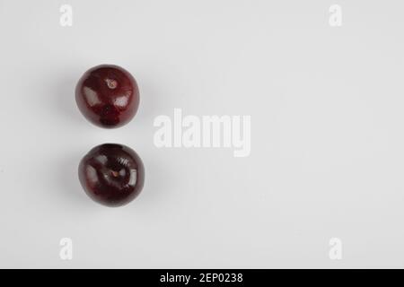 Two cherry plums isolated on white background Stock Photo