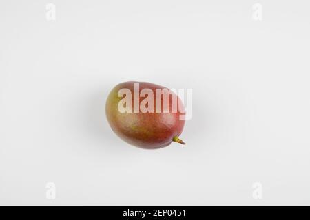 Delicious exotic mango fruit isolated on white background Stock Photo