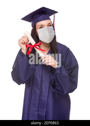 Graduating Female Wearing Medical Face Mask and Cap and Gown  Isolated on a White Background. Stock Photo