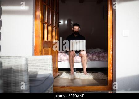 handsome man working remotely from a cottage Stock Photo