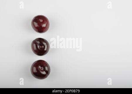 Three cherry plums isolated on white background Stock Photo