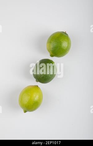 Three ripe lime fruits isolated on white background Stock Photo