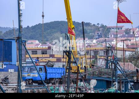 Fishing boats stop at Lanshan fishing port after catching enough ...