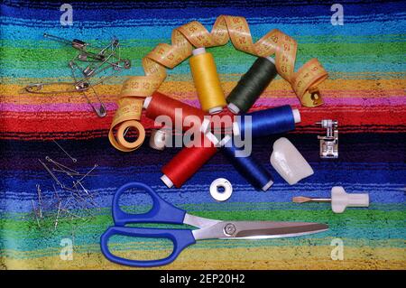 The most essential tools for cutting and sewing top view scissors threads needles pins bobbin thimble Stock Photo