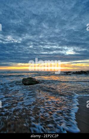 Beautiful cloudy sunset on the beach in Bretignolles France Stock Photo