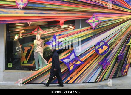 A pedestrian walks past the shop windows of the newly renovated Louis  Vuitton flagship store with decorations designed by Sarah Crowner in New  Bond Street. (Photo by Amer Ghazzal / SOPA Images/Sipa