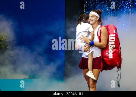 Aryna Sabalenka of Belarus holding her daughter arrives at the court