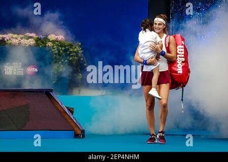 Aryna Sabalenka of Belarus holding her daughter arrives at the court