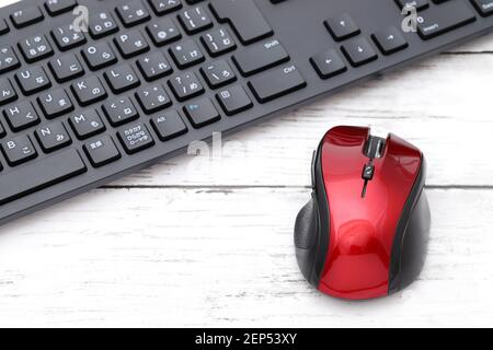 computer mouse and mouse pad on white wooden table Stock Photo