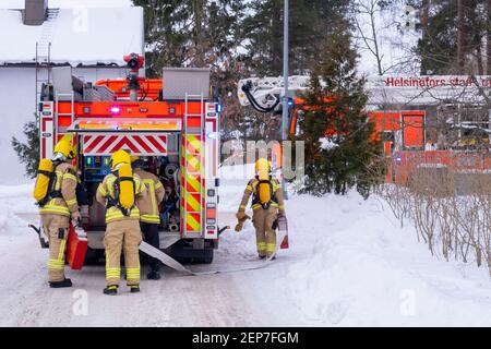 Helsinki / Finland - FEBRUARY 19, 2021: Helsiki City fire and rescue department responding to the residential structure fire. Stock Photo