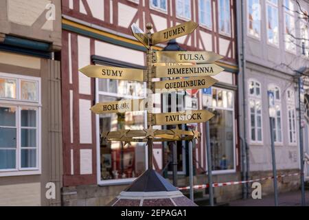 German city Celle has many sister cities. There is a signpost in old town showing direction and distances to them. Stock Photo