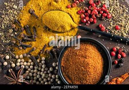 various spices on wooden table close up top view Stock Photo
