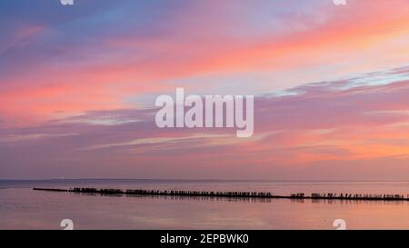Sunrise over the Waddensea near the village of Wierum in the province of Friesland. Stock Photo