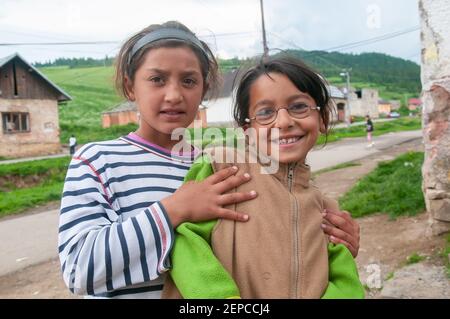 Lomnicka, Slovakia. 05-16-2018. Smiling Gypsy girls living in misery and poverty in a abandoned Roma community in the heart of Slovakia. Stock Photo