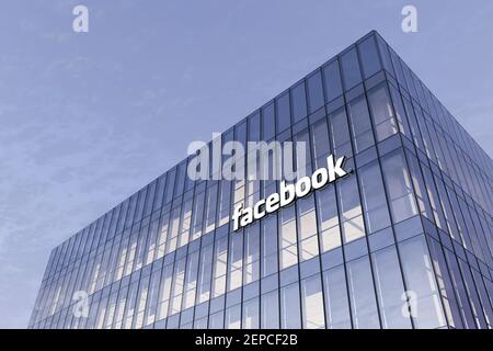 Menlo Park, California, USA. February 25, 2021. Editorial Use Only, 3D CGI. Facebook Signage Logo on Top of Glass Building. Workplace Social Networkin Stock Photo