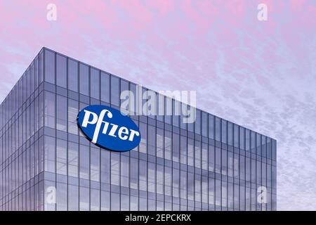 New York, The USA. February 16, 2021. Editorial Use Only, 3D CGI. Pharmaceutical Company Pfizer Signage Logo on Top of Glass Building. Workplace in Hi