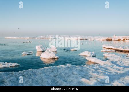 Winter coastal landscape with floating ice. Baltic sea in evening light Stock Photo