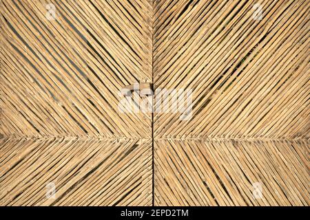 Tropical pattern, wooden braided texture. Abstract background, unique rattan handmade mat detail. Stock Photo