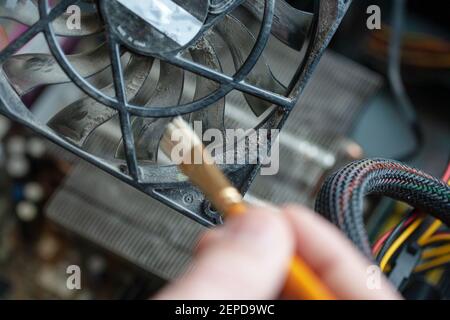 dust cleaning from dirty computer hardware. cleaning service. computer fan with lot of dust. Stock Photo