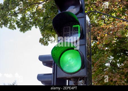 green number seven shown on digital display of traffic light signal. lucky concept. sky and trees at background Stock Photo