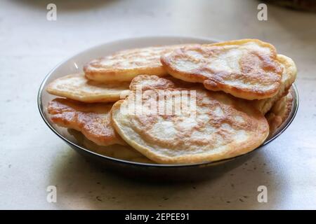fresh pancakes on a glass dish. authentic homemade food. background backdrop Stock Photo
