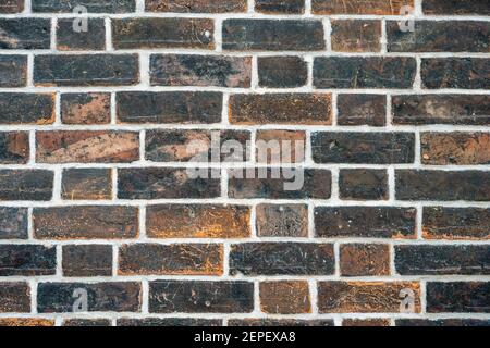 Background from an old dark red brick wall Stock Photo