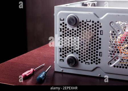 home desktop pc at wooden table for dust cleaning and maintenance service. fixing and upgrading computer equipment Stock Photo