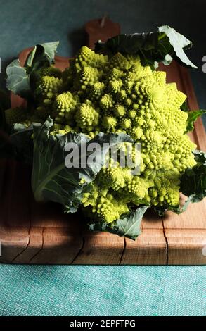 Fresh romanesco broccoli or cauliflower isolated on dark background. Closeup. Stock Photo