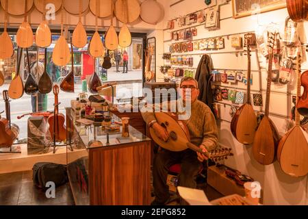 Traditional Turkey Instruments Interior view of Turkish musical instrument with hanging lute and ...