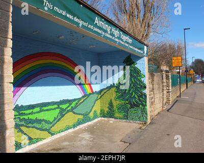 Large mural with rainbow, symbol of hope during the Covid-19 pandemic. It was painted by schoolchildren from Loxley Primary school in 1st UK lockdown Stock Photo