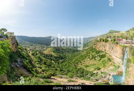 Panorama of Jezzine town and landscape with famous 90 meter high waterfall pouring into a dry valley, in Southern Lebanon Stock Photo