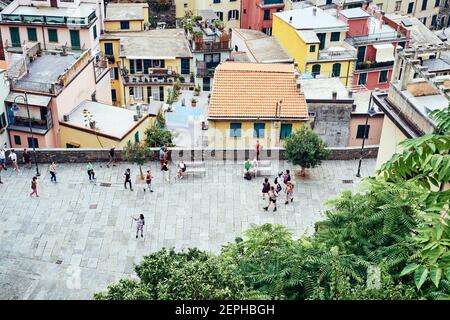 Riomaggiore, Italy- September 17, 2018:Tourists in the church square of the Cinque Terre town, photographed from above Stock Photo
