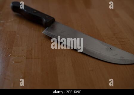 Knife on a wooden table Stock Photo