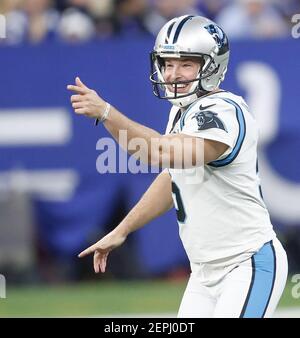 An NFL football is placed on a kicking tee and is ready for the kickoff to  start the play Stock Photo - Alamy