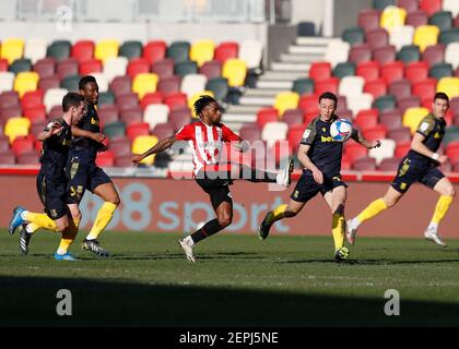 27th February 2021; Brentford Community Stadium, London, England; English Football League Championship Football, Brentford FC versus Stoke City; Tariqe Fosu of Brentford clearing the ball into midfield Stock Photo