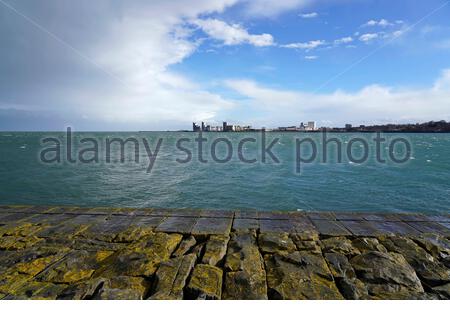 View over the Forth estuary towards the modern development at Leith from the breakwater at Granton harbour, Edinburgh, Scotland Stock Photo