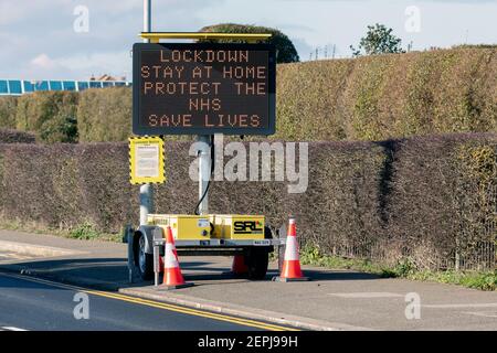 SOUTHEND-ON-SEA, ESSEX, UK - FEBRUARY 05, 2021:  Mobile dot-matrix road sign showing a Coronavirus lockdown message to protect the NHS message Stock Photo