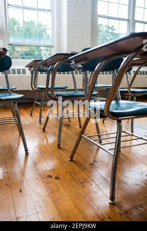 School desks in a classroom interior Stock Photo