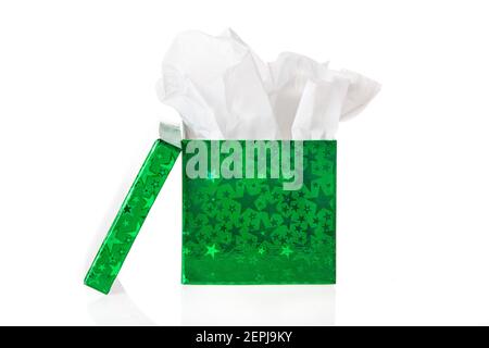A green foil gift box with tissue paper inside. Stock Photo