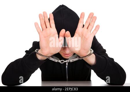 Young Man in Handcuffs on the White Background Stock Photo