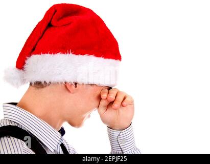 Sad Young Man in Santa Hat Isolated on The White Background Stock Photo