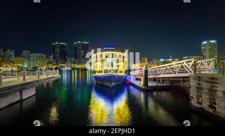 Dubai, UAE, 13 November 2020: View of Dubai Creek in Old Dubai in Al Seef Area. Beautiful view of a docked yacht with a stunning reflection on the wat Stock Photo