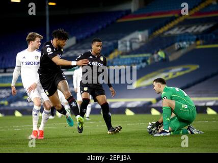 Leeds United's Patrick Bamford (left) has a shot on goal saved by Aston Villa goalkeeper Emiliano Martinez during the Premier League match at Elland Road, Leeds. Picture date: Saturday February 27, 2021. Stock Photo