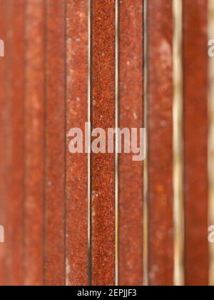 BACKGROUND TEXTURE - Rusty iron bars on an old wrought iron gate with shallow depth of field Stock Photo