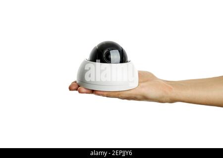 cctv surveillance camera at caucasian persons hand. isolated on a white background Stock Photo