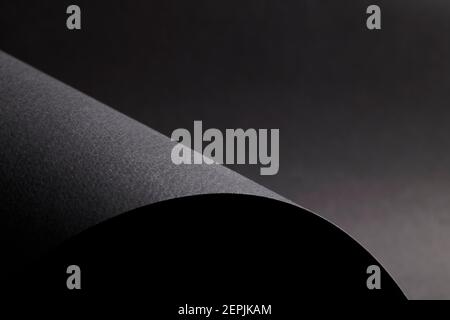 elegance wave shaped black background made by dark paper Stock Photo
