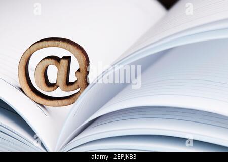 business communication mail technology concept. email symbol over notepad background Stock Photo